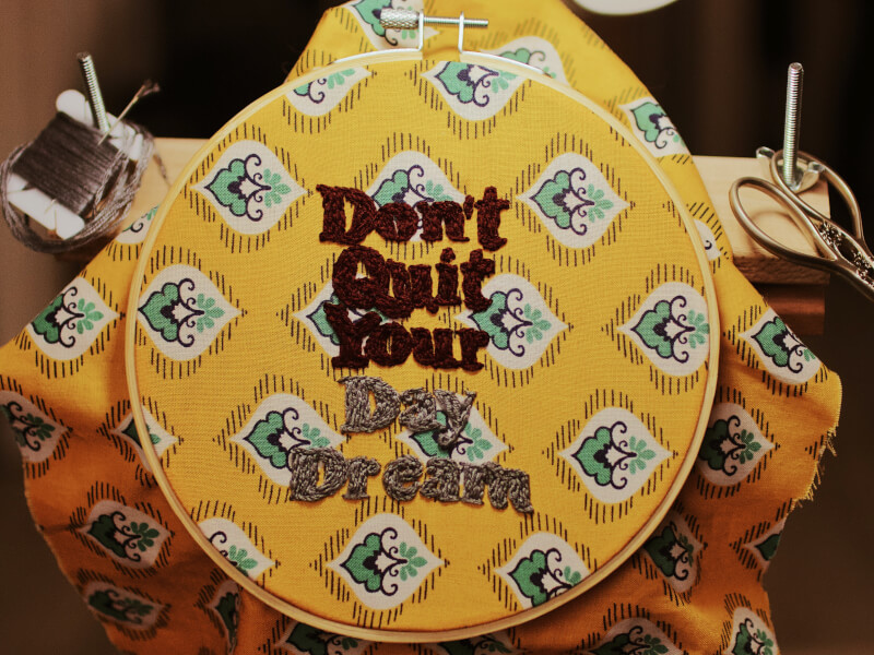Slogan embroidered in a circle frame